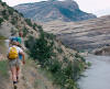 Teddy, Tom (facing camera), and Stan hiking in Dinosaur Natl Monument