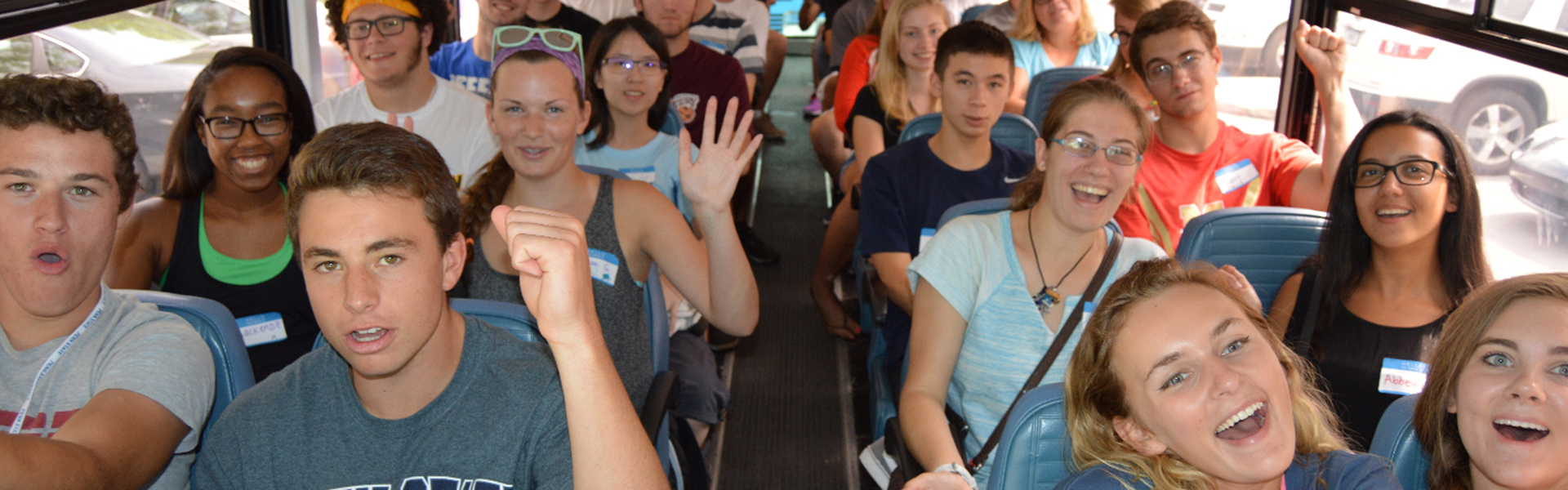 students on bus to TOTEMS orientation