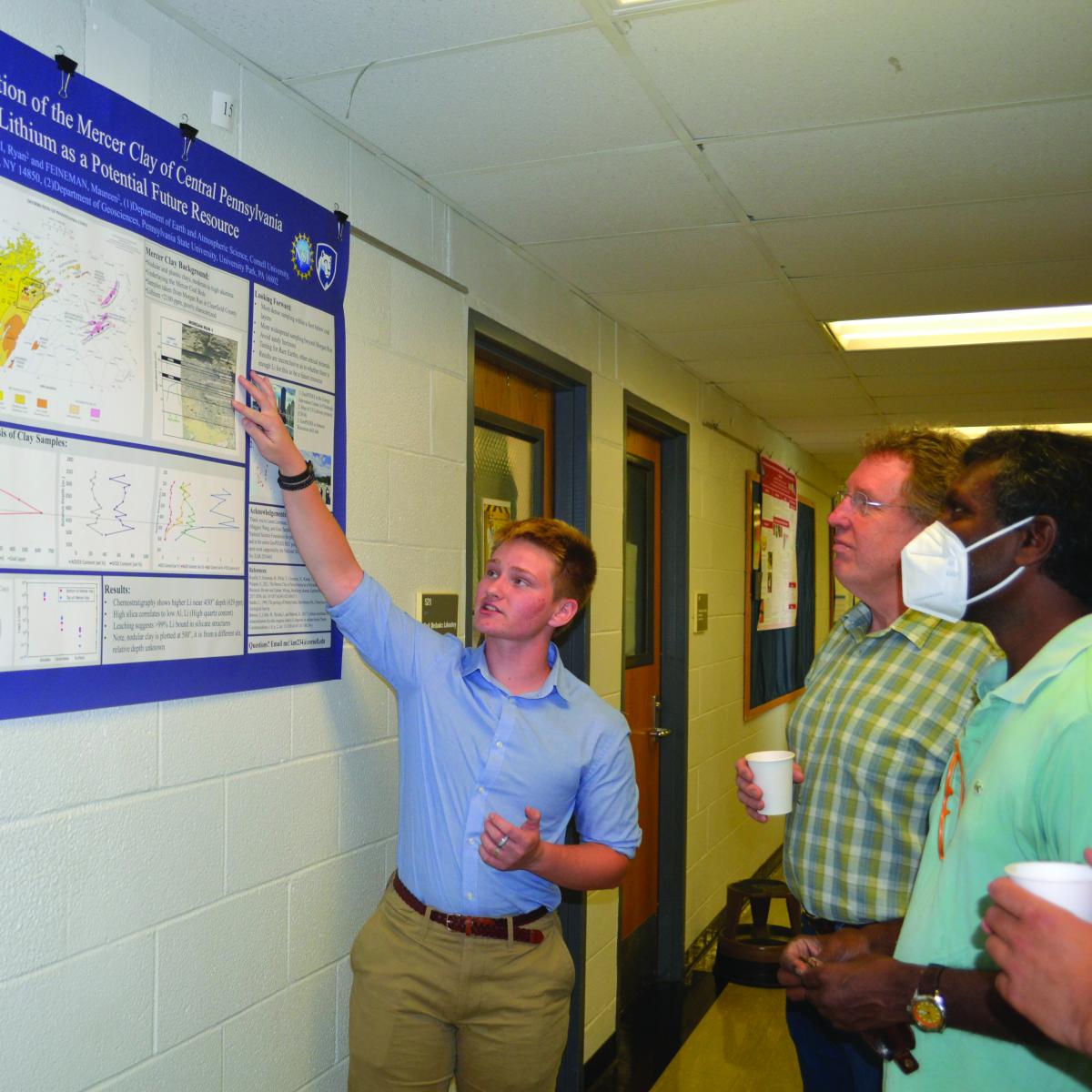 student pointing to a map and describing the map