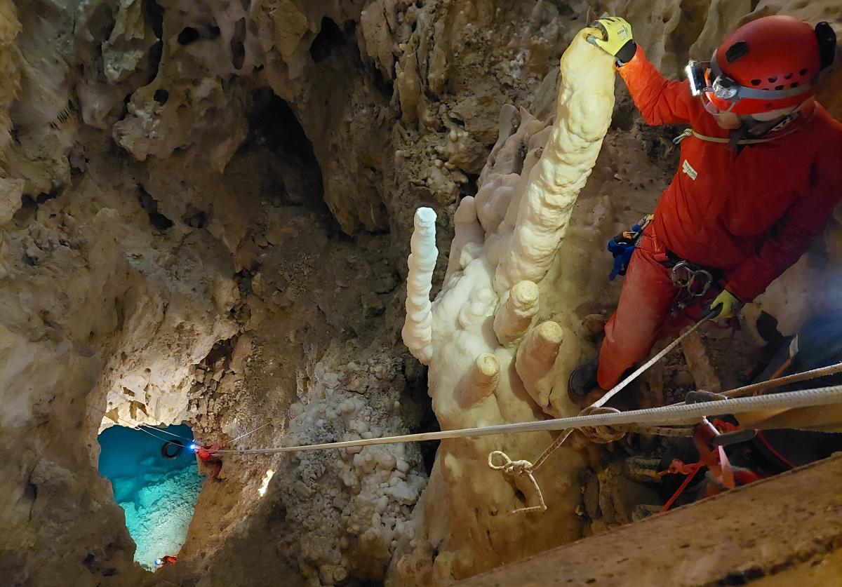 An underwater photographer peers down the 80-foot drop to Lago dell’Orsa,